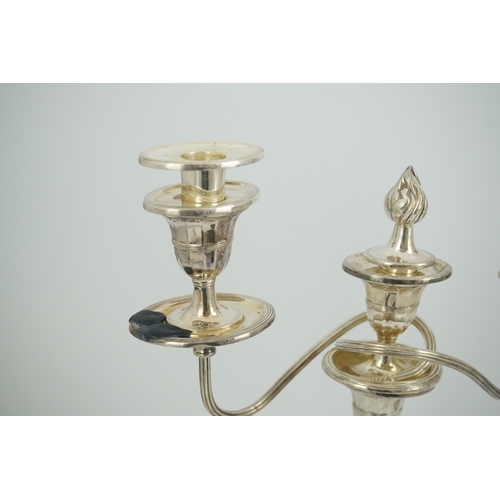 86 - A modern pair of silver two branch three light oval candelabra, by James Dixon and Sons Ltd, with re... 