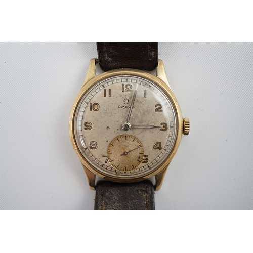 90 - A gentleman's early 1940's 9ct gold Omega manual wind wrist watch, with Arabic dial and subsidiary s... 