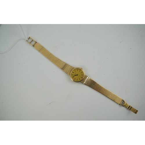 93 - A lady's early 1980's 9ct gold Tissot quartz wrist watch with textured 9ct gold associated bracelet,... 