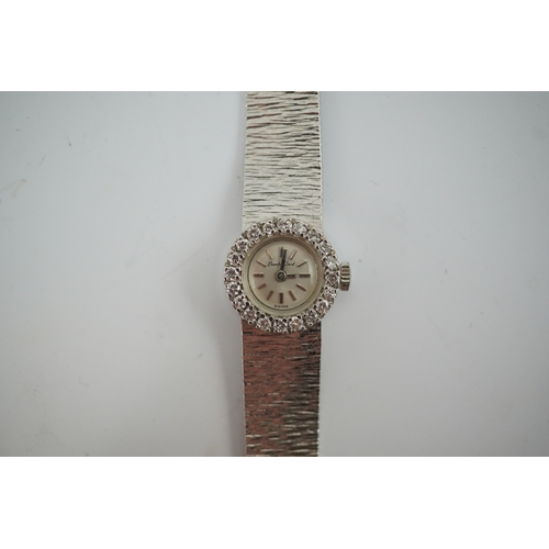 96 - A lady's 9ct white gold and diamond set Bueche Girod manual wind wrist watch, with baton numerals, d... 