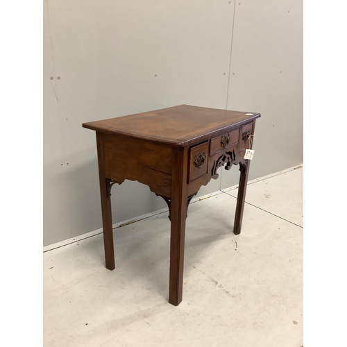 1008 - A mid 18th century walnut lowboy quarter veneered with a rectangular top above three drawers and a p... 