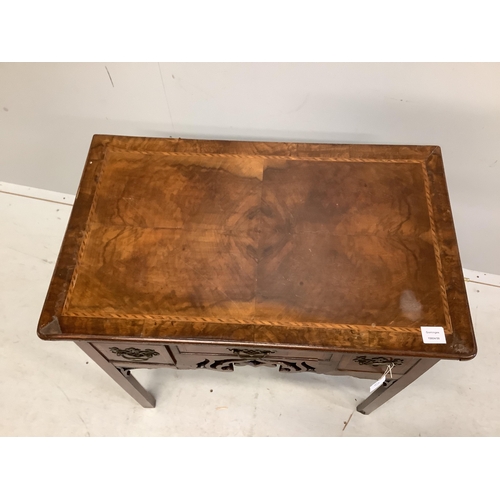 1008 - A mid 18th century walnut lowboy quarter veneered with a rectangular top above three drawers and a p... 