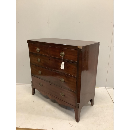 1011 - An early Victorian crossbanded mahogany chest of two short and three long drawers, with brass oval l... 