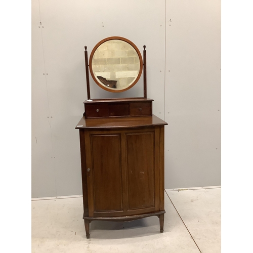 1015 - An early 20th century mahogany bowfront dressing chest, with bevelled plate circular mirror, and pan... 