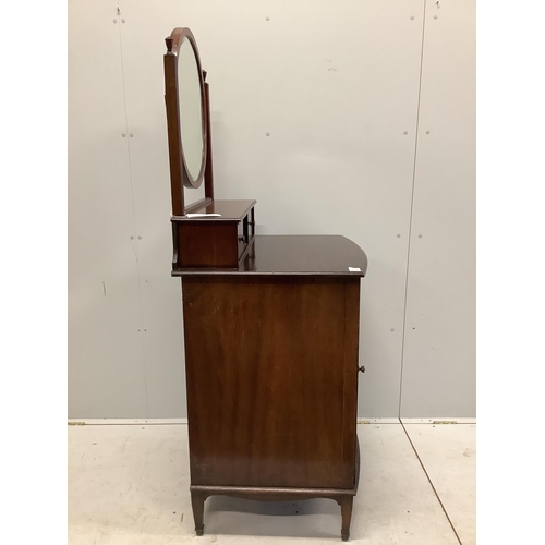 1015 - An early 20th century mahogany bowfront dressing chest, with bevelled plate circular mirror, and pan... 