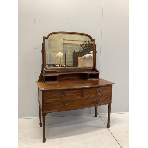 1019 - An early 20th century mahogany bowfront dressing table, fitted two short and one long drawer with br... 