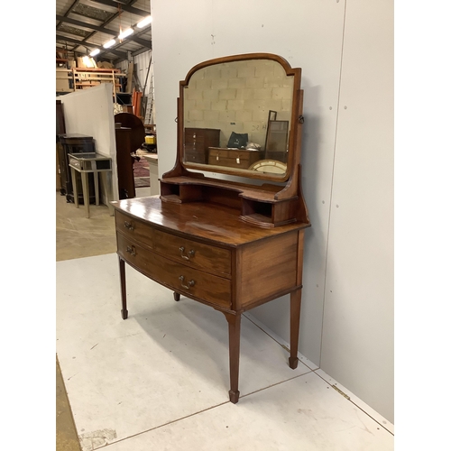 1019 - An early 20th century mahogany bowfront dressing table, fitted two short and one long drawer with br... 