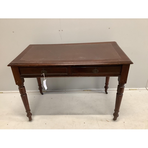 1020 - An early 20th century mahogany writing table with two frieze drawers with brass ring handles on turn... 