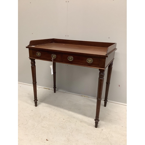 1043 - A Regency mahogany two drawer dressing table with a galleried top, on ring turned legs, width 91cm, ... 