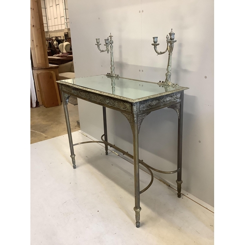 1046 - An early 20th century mirrored, embossed brass dressing table, width 96cm, depth 48cm, height 118cm.... 