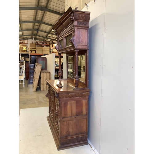 1052 - A 19th century Flemish carved oak buffet, width 139cm, depth 54cm, height 214cm. Condition - fair, t... 