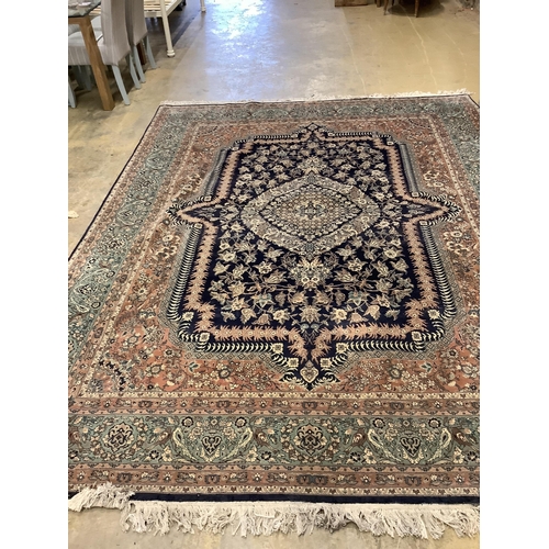 1054 - An Isfahan design blue ground rug, 330 x 250cm. Condition - good