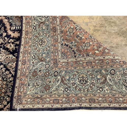 1054 - An Isfahan design blue ground rug, 330 x 250cm. Condition - good