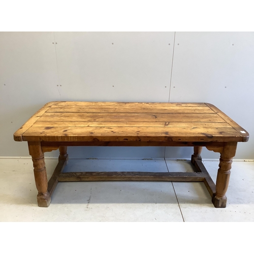 1080 - An 18th century style rectangular pine refectory table, width 180cm, depth 90cm, height 72cm. Condit... 