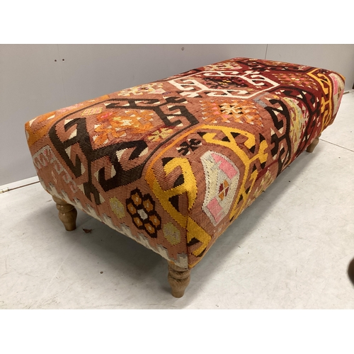 1081 - A large contemporary rectangular footstool with antique polychrome Kilim upholstery on turned beech ... 