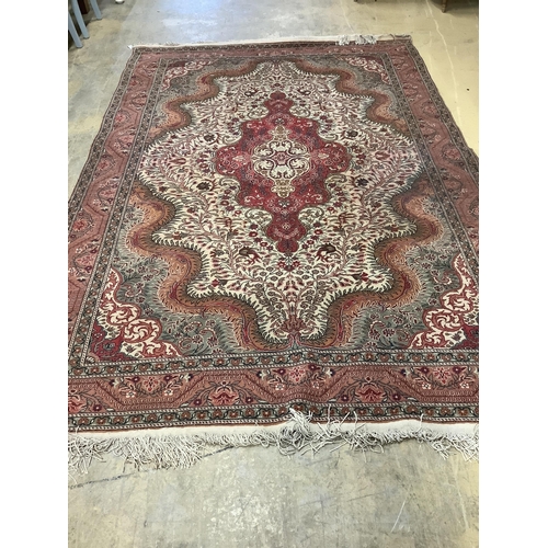 1089 - A Persian style beige ground carpet, 290 x 197cm. Condition - fair to good