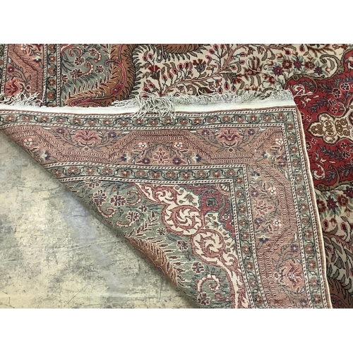 1089 - A Persian style beige ground carpet, 290 x 197cm. Condition - fair to good