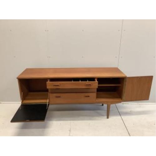 1091 - A mid century teak sideboard, probably Nathan Furniture, width 153cm, depth 44cm, height 72cm. Condi... 