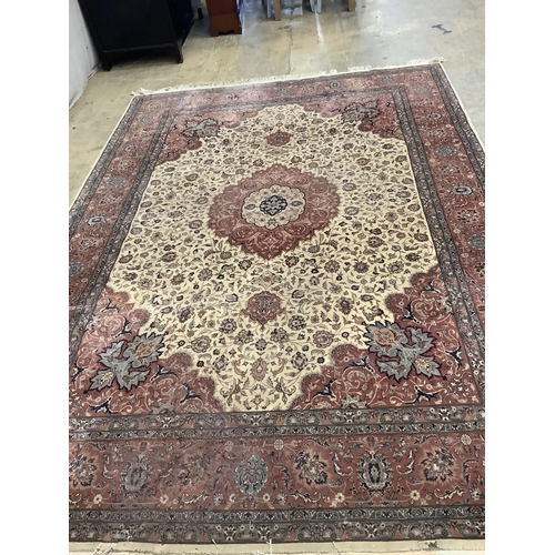 1106 - An Isfahan design ivory ground rug, approximately 340 x 246cm. Condition - good