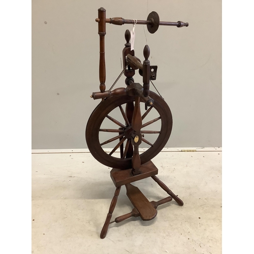 1123 - Two 19th century spinning wheels, larger height 124cm. Condition - fair