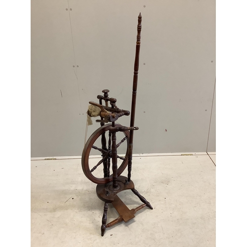 1123 - Two 19th century spinning wheels, larger height 124cm. Condition - fair