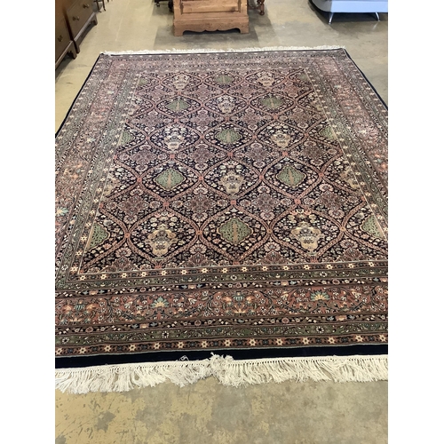 1129 - An Indian wool carpet, 372 x 274cm. Condition - good