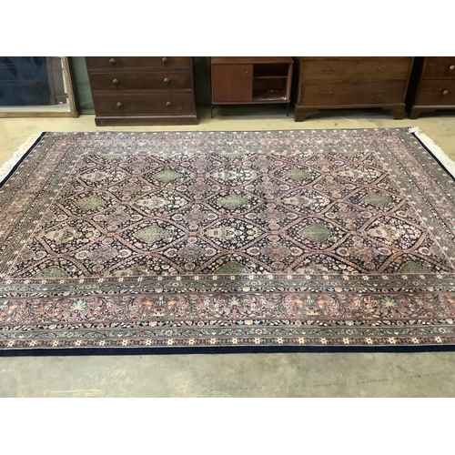 1129 - An Indian wool carpet, 372 x 274cm. Condition - good