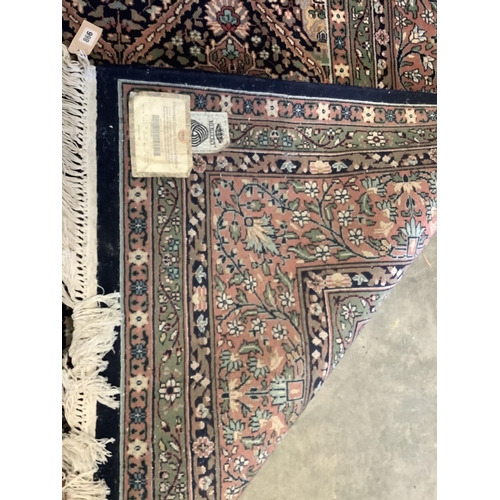 1129 - An Indian wool carpet, 372 x 274cm. Condition - good