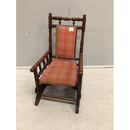 1140 - A late 19th century American turned beech childs rocking chair, width 39cm, depth 49cm, height 66cm... 