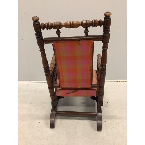 1140 - A late 19th century American turned beech childs rocking chair, width 39cm, depth 49cm, height 66cm... 