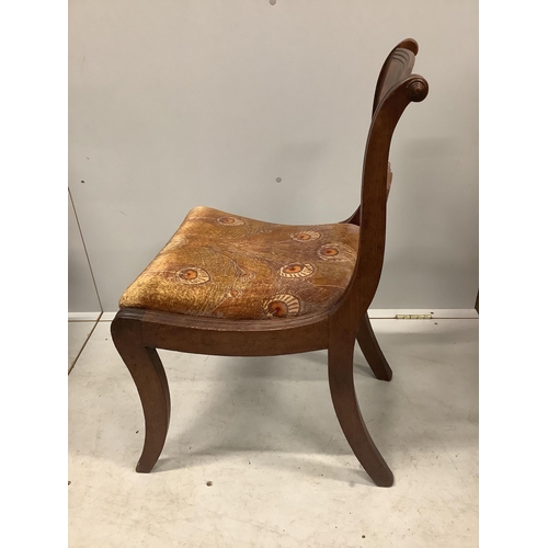 1144 - A set of four Regency mahogany dining chairs with sabre legs and roundel spars. Condition - poor to ... 