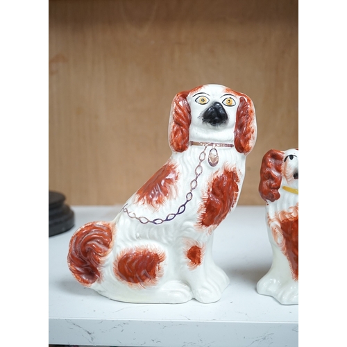 1253 - A pair of Staffordshire potter spaniels, and a similar smaller example, taller 18cm. Condition - sma... 