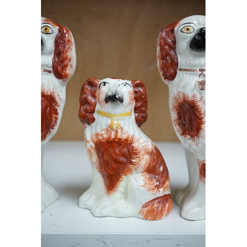 1253 - A pair of Staffordshire potter spaniels, and a similar smaller example, taller 18cm. Condition - sma... 