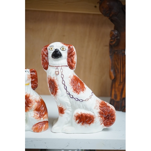 1253 - A pair of Staffordshire potter spaniels, and a similar smaller example, taller 18cm. Condition - sma... 