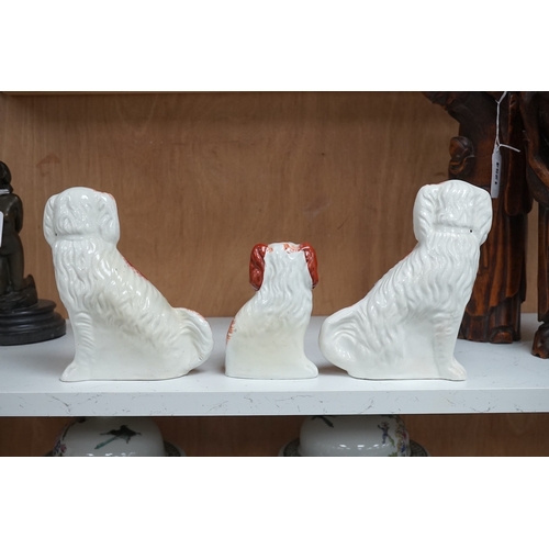 1253 - A pair of Staffordshire potter spaniels, and a similar smaller example, taller 18cm. Condition - sma... 