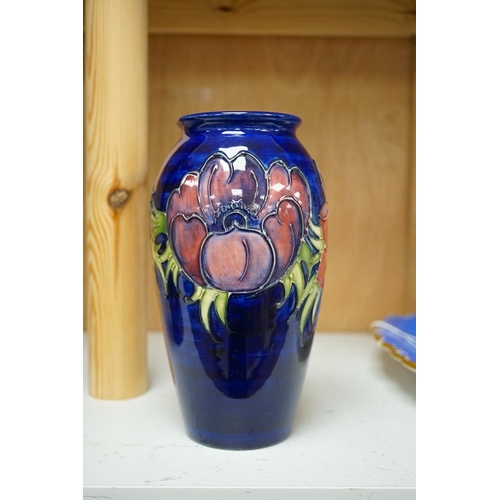 1255 - A Moorcroft anemone pattern vase, 18.5cm tall. Condition - good