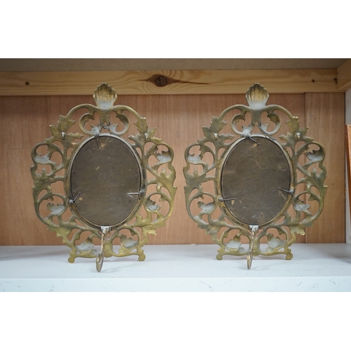 1258 - A pair of decorative oval ormolu easel framed mirrors, 28cm. Condition - good