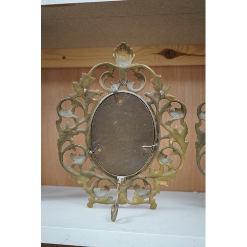 1258 - A pair of decorative oval ormolu easel framed mirrors, 28cm. Condition - good