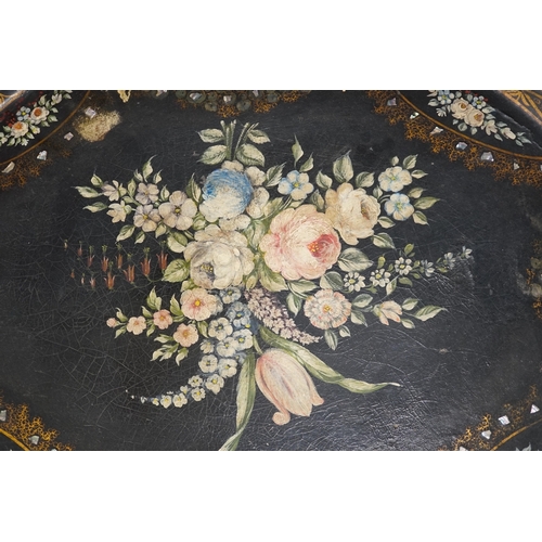 1272 - An oval papier mache tray with abalone inlay, hand painted with roses, 75cm wide. Condition - fair... 