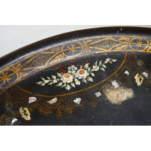 1272 - An oval papier mache tray with abalone inlay, hand painted with roses, 75cm wide. Condition - fair... 