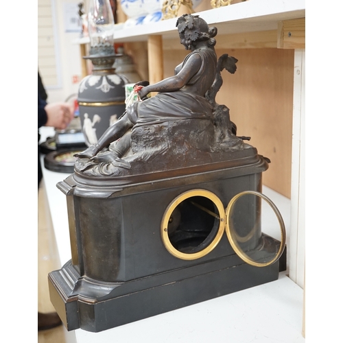 1276 - A Victorian black marble eight day mantel clock, surmounted by a cast bronze figure of a muse, with ... 