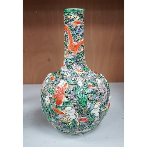 1277 - A Chinese moulded and reticulated porcelain eighteen luohan bottle vase, early 20th century, 34cm hi... 