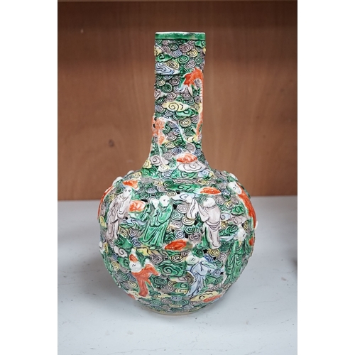 1277 - A Chinese moulded and reticulated porcelain eighteen luohan bottle vase, early 20th century, 34cm hi... 