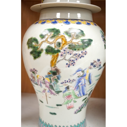 1281 - A pair of Chinese famille rose baluster vases and covers, 44cm high. Condition - good