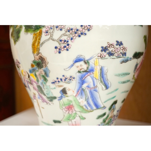 1281 - A pair of Chinese famille rose baluster vases and covers, 44cm high. Condition - good