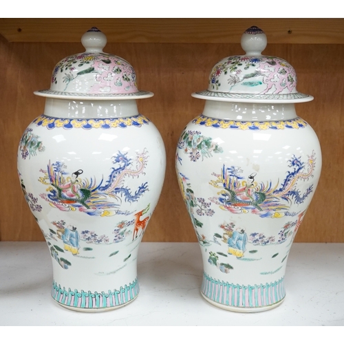 1281 - A pair of Chinese famille rose baluster vases and covers, 44cm high. Condition - good