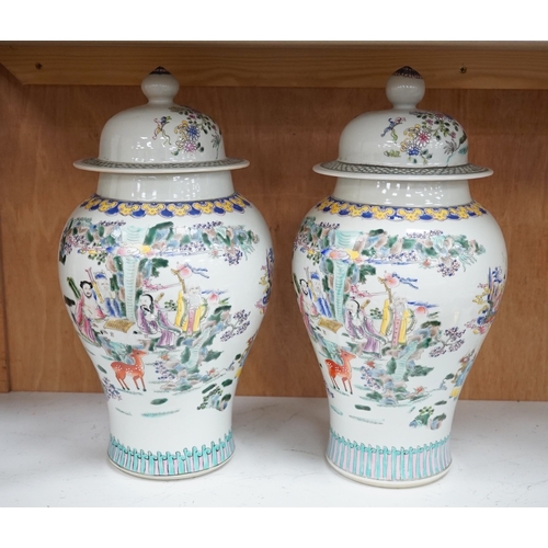 1281 - A pair of Chinese famille rose baluster vases and covers, 44cm high. Condition - good