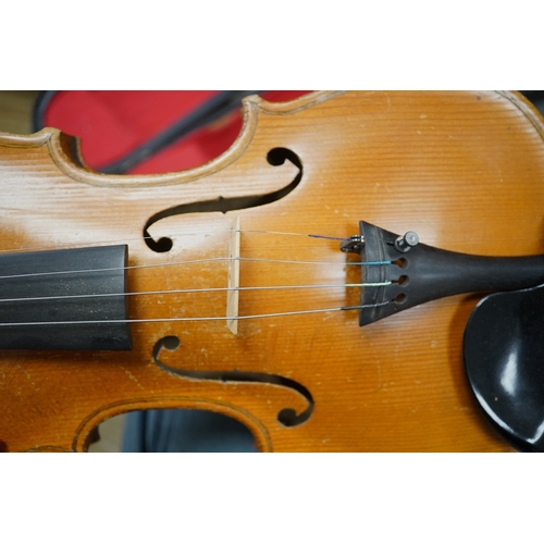 1286 - Two cased three quarter size violins, one labelled the London violin Co Ltd, length of back 33.5cm. ... 