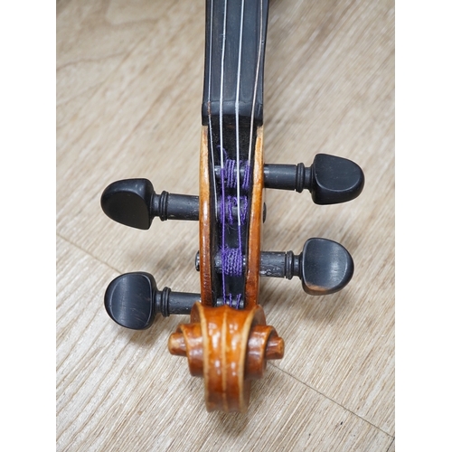 1286 - Two cased three quarter size violins, one labelled the London violin Co Ltd, length of back 33.5cm. ... 