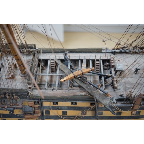 1289 - A large model of a rigged ship, 84cm long. Condition - fair